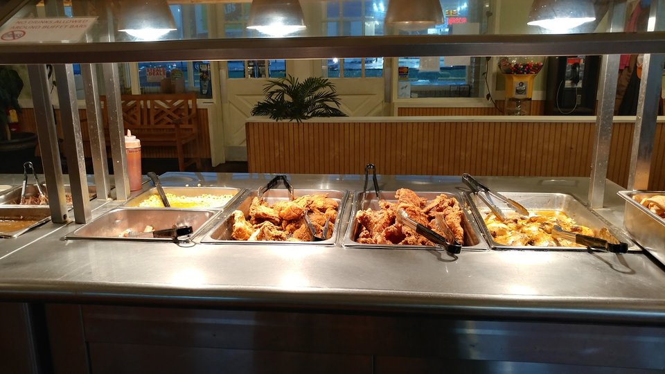Warm restaurant interior with table service and seating